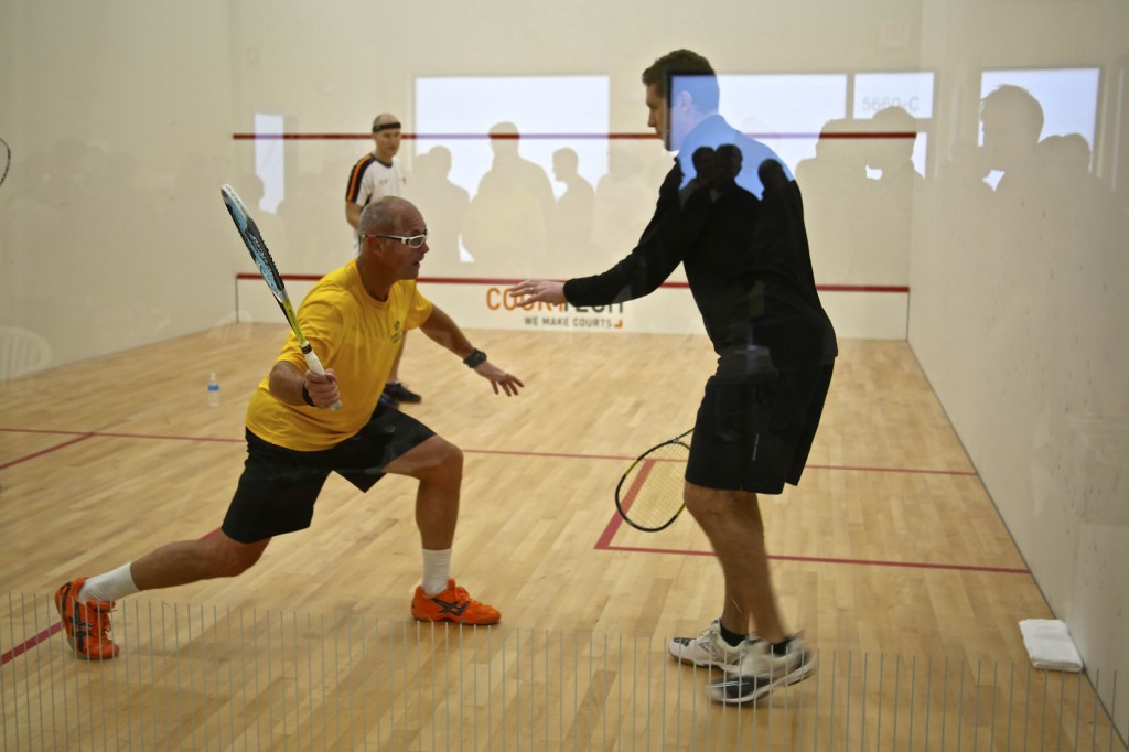 Former world No. 1 David Palmer (R) runs a clinic at the Charlotte Squash Club during the facility's opening ceremony in November.  (image: Charlotte Squash Club)