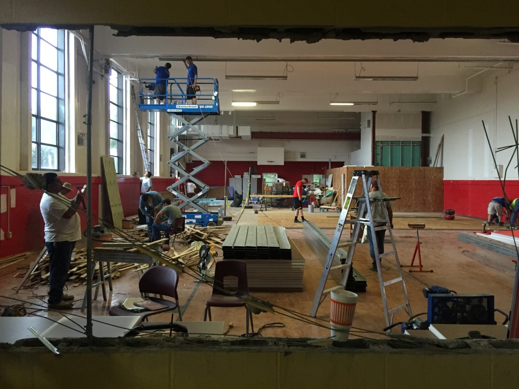 Day four of construction, students and volunteers help break down the gym and prepare for incoming squash courts (Image: Alistair Barnes) 