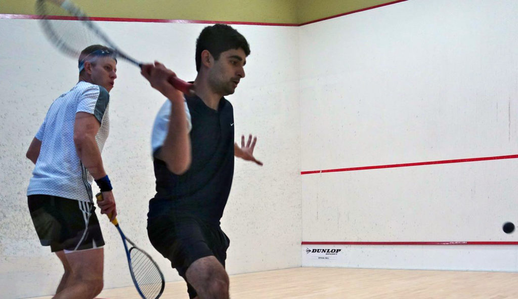 Khan (R) against Mauricio Sedano in his opening Kiva Club Open match. (image: Kiva Club Open)