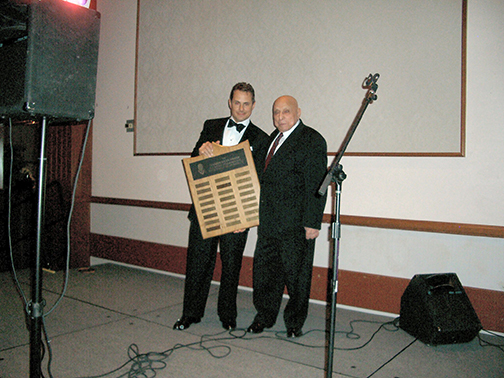 At the 25th annual Hashim Khan Championships, Hashim presents corporate sponsor Vince DeRose, of Peak Resources, Inc., with the Hashim Khan trophy. (image: Tony Pett)