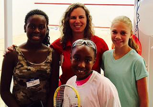 Principal Angela Sugarek celebrates the opening of new squash courts at Hogg MS with some of her students on August 29