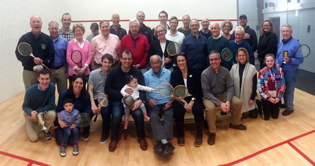 Charlie Butt (center) surrounded by members of the Portland squash community.
